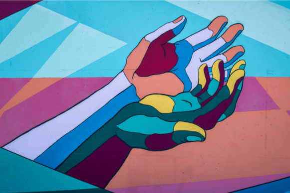 Art of multi coloured hands reaching out
